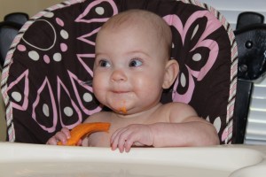 Baby Kinley eating sweet potatoes