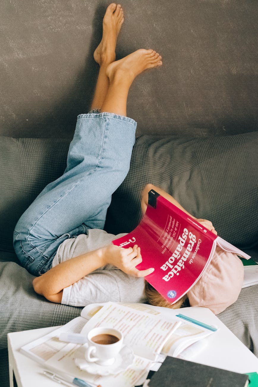 woman lying with legs raised on wall